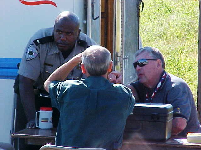 Police personnel discuss what actions to take.